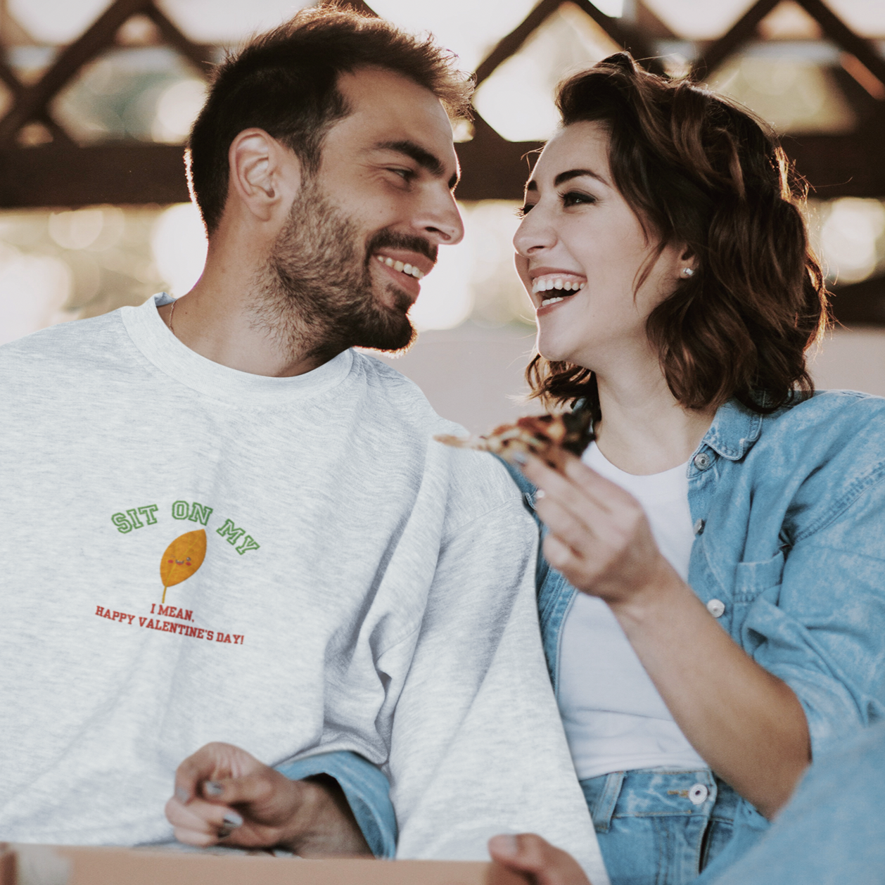 Add a spark of humor to Valentine’s Day with our ‘Sit On My (smiling leaf design)’ sweatshirt!