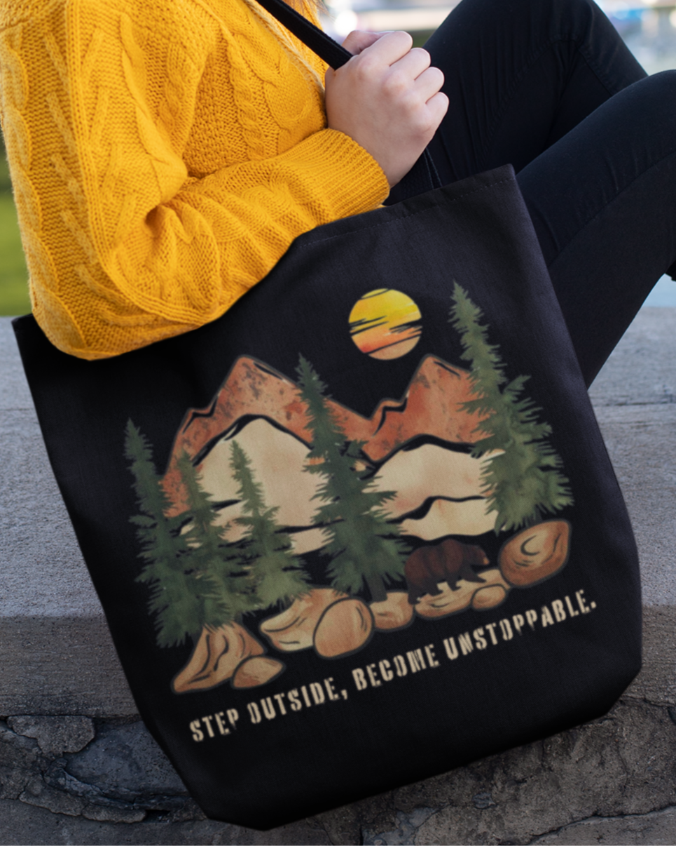 Eco-friendly and versatile tote bag with a scenic forest design, customizable handle colors, and an inspiring message for outdoor enthusiasts.