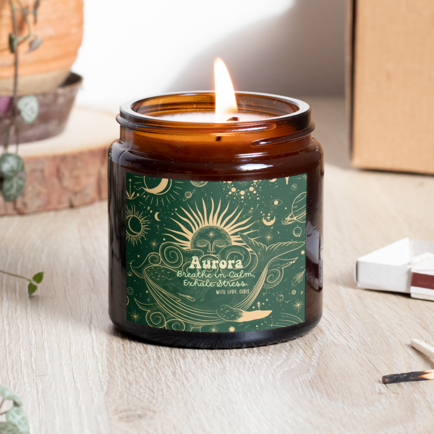 Personalized scented candle featuring the phrase 'Breathe in Calm, Exhale Stress'. Available in 4 and 9 oz, with a mystical background in golden and green tones, and 9 fragrances to choose from.